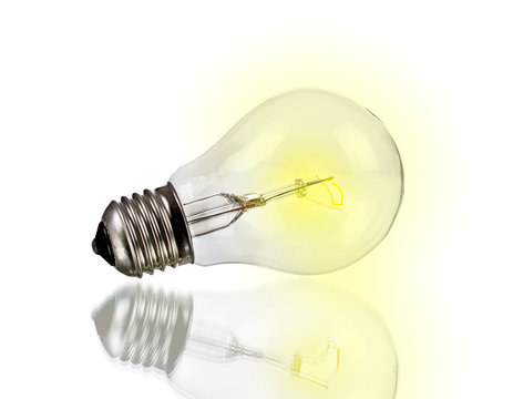 Glowing yellow light bulb