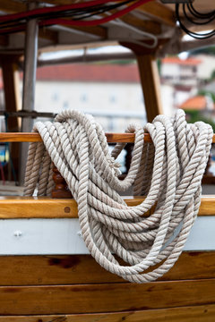 Rope bundle on a wooden boat side