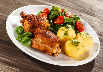 Grilled chicken legs with vegetables