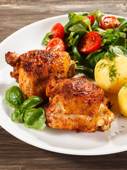 Grilled chicken legs with vegetables