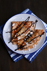 Delicious pancakes with blueberries on table close-up