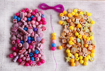 Different beads and lace on fabric on fabric background