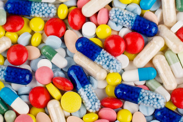 Fototapeta na wymiar Color pills and capsules background