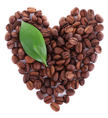Heart shaped coffee beans isolated on white