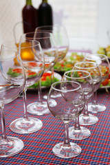 Buffet table with dishware waiting for guests