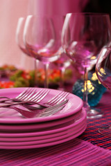 Buffet table with dishware waiting for guests