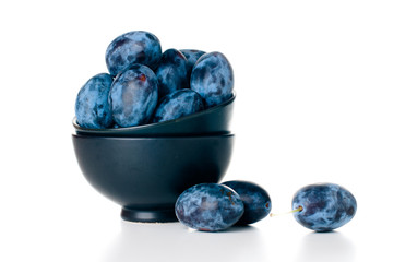 plums in a ceramic bowl