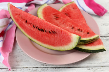 Fresh slice of watermelon on table outdoors, close up