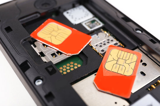cell phone and two sim cards, close up