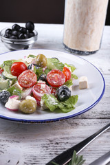 Plate of Greek salad served with olives