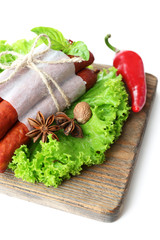 Smoked thin sausages  with lettuce salad leaves