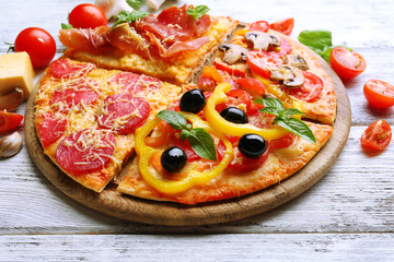 Delicious pizza served on wooden table