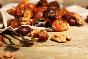 Tasty dates fruits on wooden table