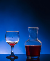 glass red wine blue background