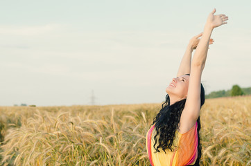 beautiful woman standing on wheat field