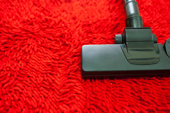 Vacuum cleaner on Red Carpet