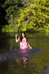 Young Japanese Woman Splashing River Dress Smiling