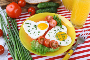 Scrambled eggs with vegetables and juice served in plate