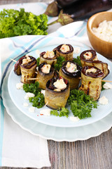 Fried aubergine with cottage cheese in a round plate