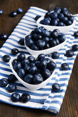 Delicious blueberries on table close-up