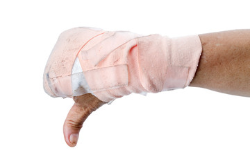 Thumb down showing by hand with bandages isolated on white