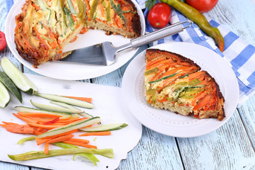Casserole with vegetables on plate on table close-up
