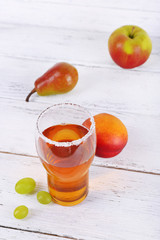 tasty summer drink with fresh fruits, on wooden table