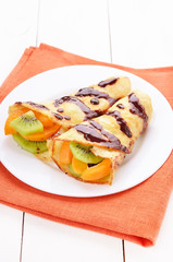 Crepes with kiwi and apricot slices