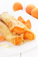 Crepes with apricot slices