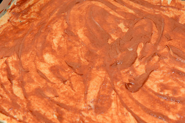 Adding sauce. Italian pizza preparation.