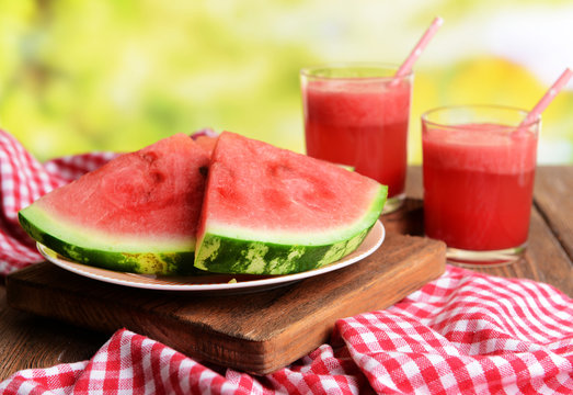 Juicy watermelon on table on bright background