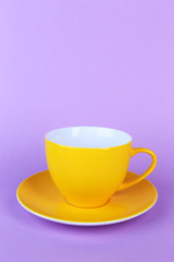 Colorful cup on color background