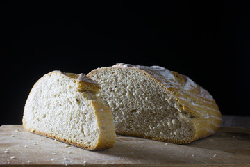 Loaf of bread on wooden board