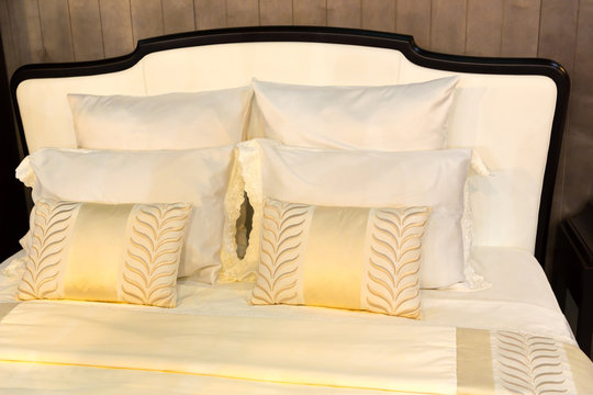Colorful pillows on hotel bed