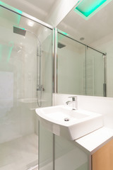 Porcelain sink in modern bathroom
