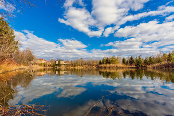 Pond and cloudy sky
