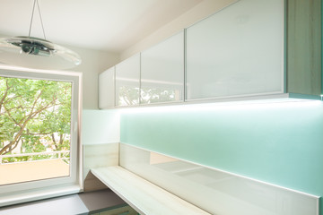 Kitchen with illuminated furniture