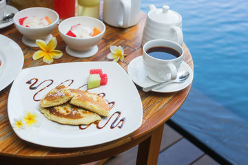 Traditional Balinese banana pancake and fruits