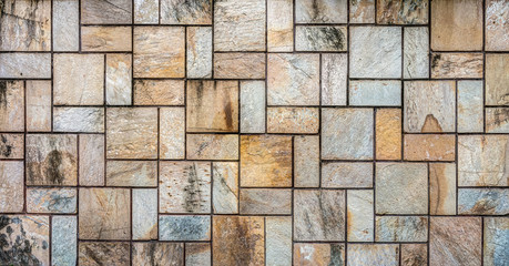 Grunge natural stone tiles wall for background and texture