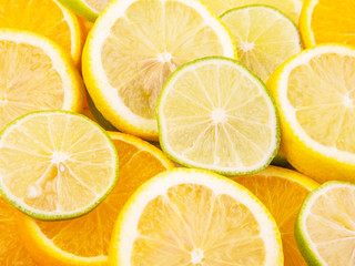 Fototapeta na wymiar Slices of lemon, lime and orange close up view