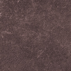 fragment of old brown scratched leather
