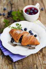 Breakfast, croissant with blueberries