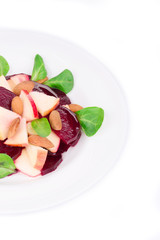 Beet salad with spinach and minced apple.
