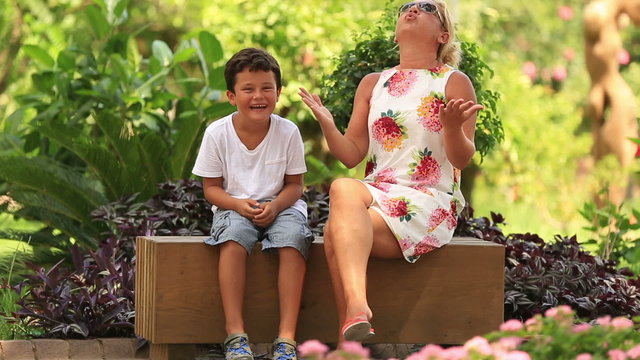 Angry Mother and impassive Son in the park
