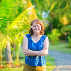 Smiling girl on a tropical beach resort on Bali