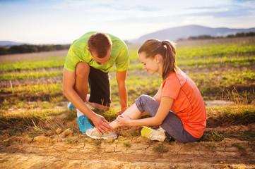 Female runner with twisted ankle