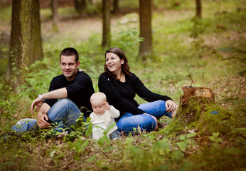 Happy family in forest