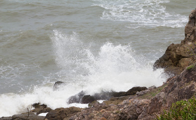 sea wave crash the rock