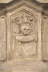 Relief with skull on a statue in town Kutna Hora
