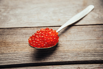 Red caviar on spoon